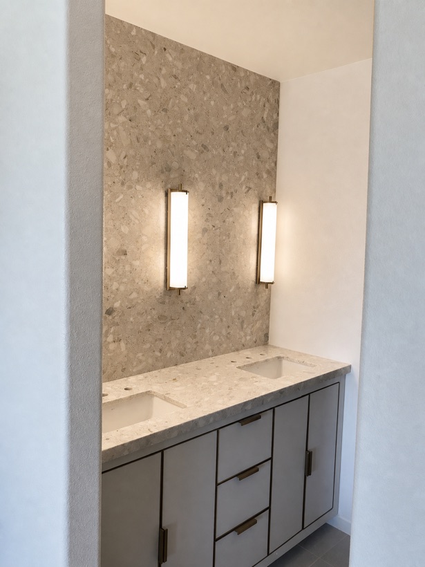 Terrazzo feature wall behind a double vanity