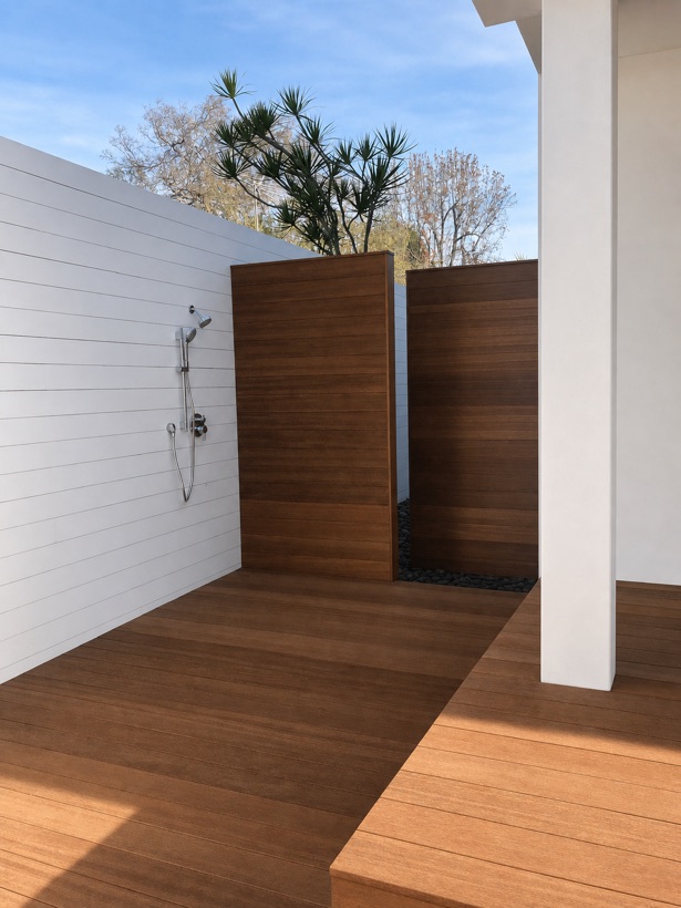 Outdoor shower enclosed by an ipe hardwood screen on a slatted ipe deck
